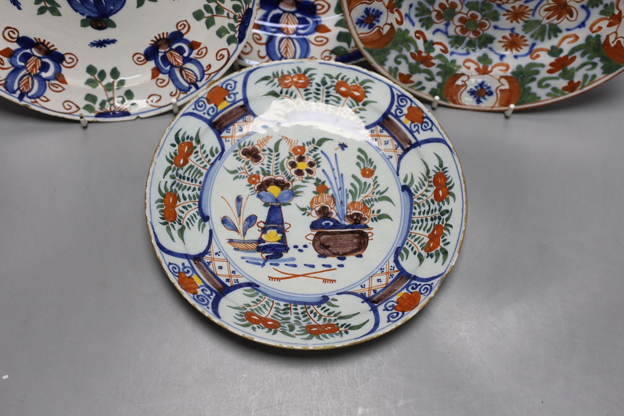 Four 18th century Dutch delft dishes, largest 30.5cm